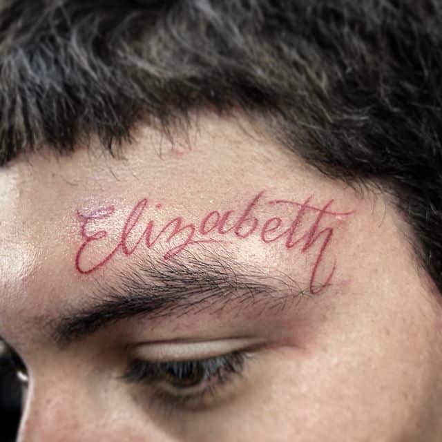 тату на лице имя