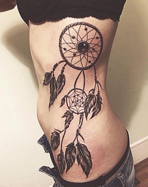 женское тату ловец снов на животе