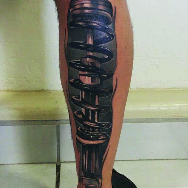 тату биомеханика на ноге