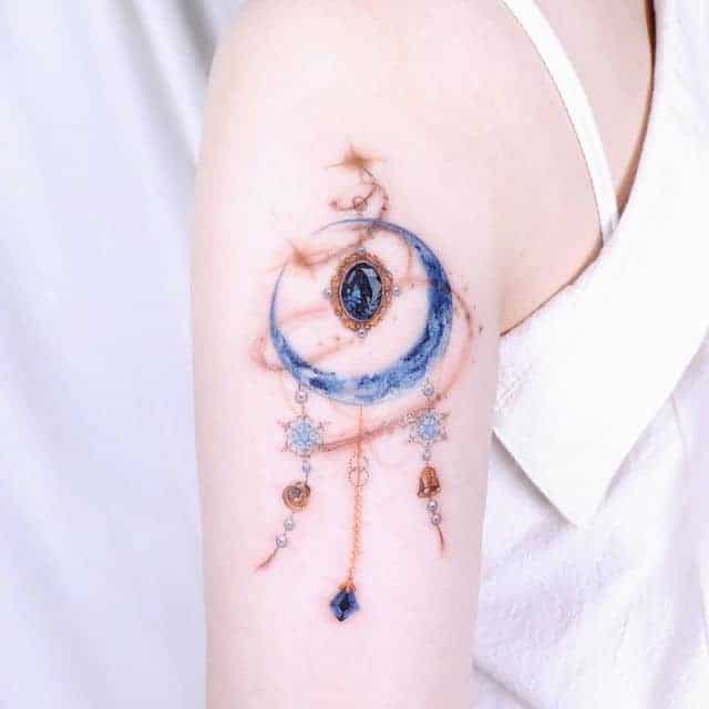 тату ловец снов и камушек