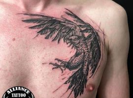 тату птах на грудях