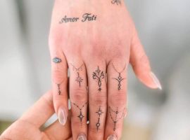 Малюнок "Amor Fati" з геометричними символами на руці, символізує прийняття долі та філософію життя. Татуювання "Amor Fati" з геометричними символами на руці.