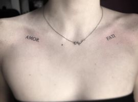 Підпис до зображення: Тату "Amor Fati" на плечах, що символізує прийняття долі та любов до життя, створене у салоні "Альянс". Тату "Amor Fati" на плечах, символ прийняття долі та любові до життя.