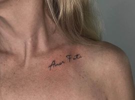 Модель з тату "Amor Fati" на плечі, створена в Тату Cалон Альянс, підкреслює індивідуальність і любов до долі. Тату "Amor Fati" на плечі, стильний дизайн для тату салону.
